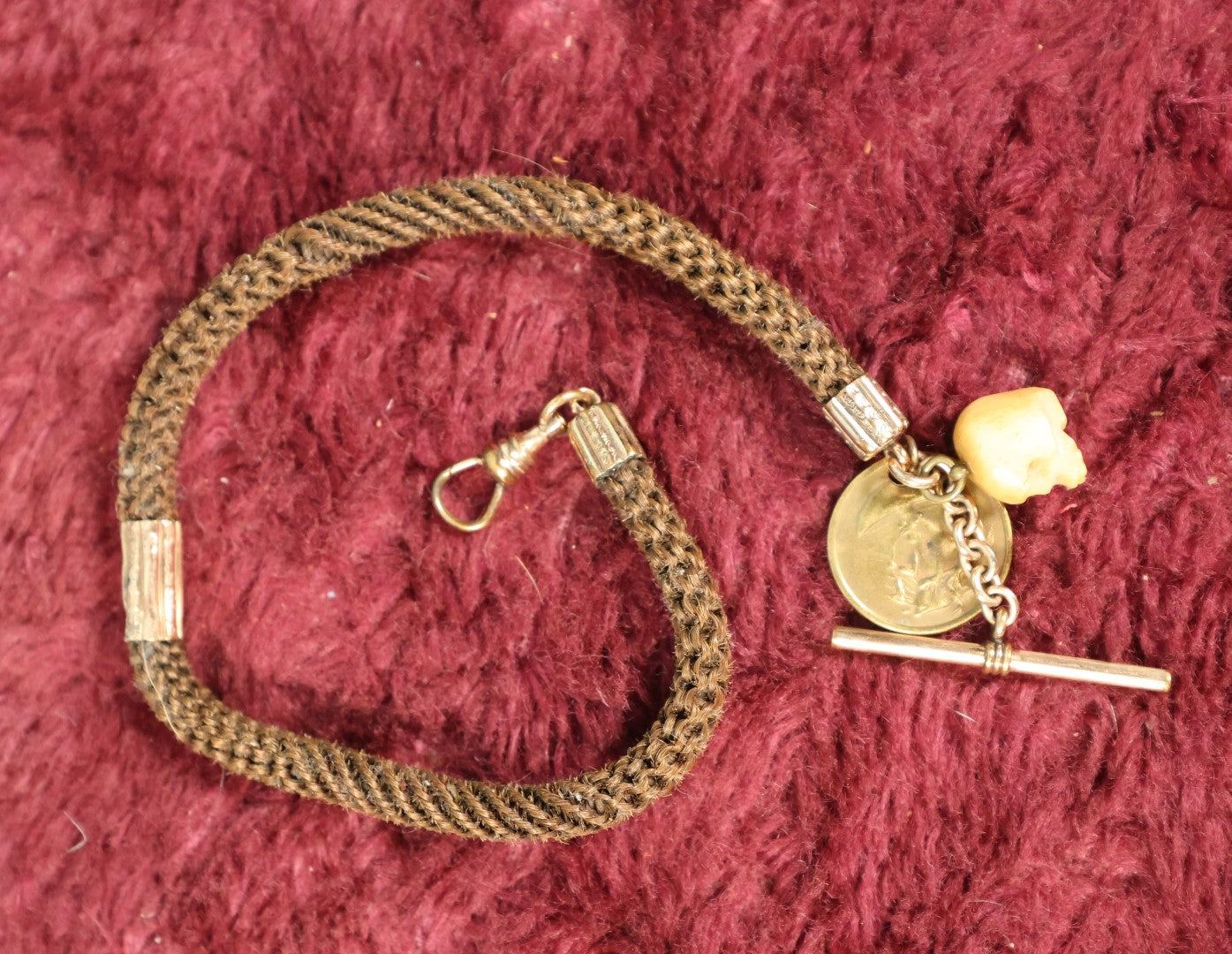 Lot 003 - Antique Victorian Human Hair Watch Chain With Carved Skull Charm And Brass Smoking Frog Coin, In Jewelry Case