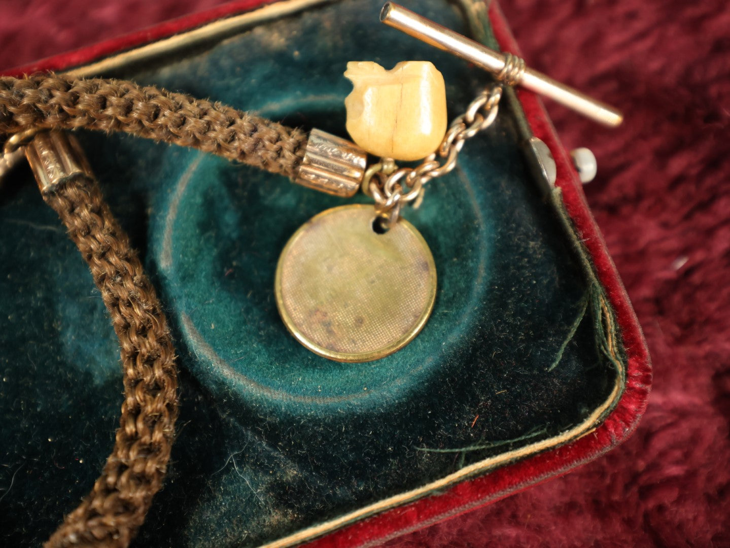 Lot 003 - Antique Victorian Human Hair Watch Chain With Carved Skull Charm And Brass Smoking Frog Coin, In Jewelry Case