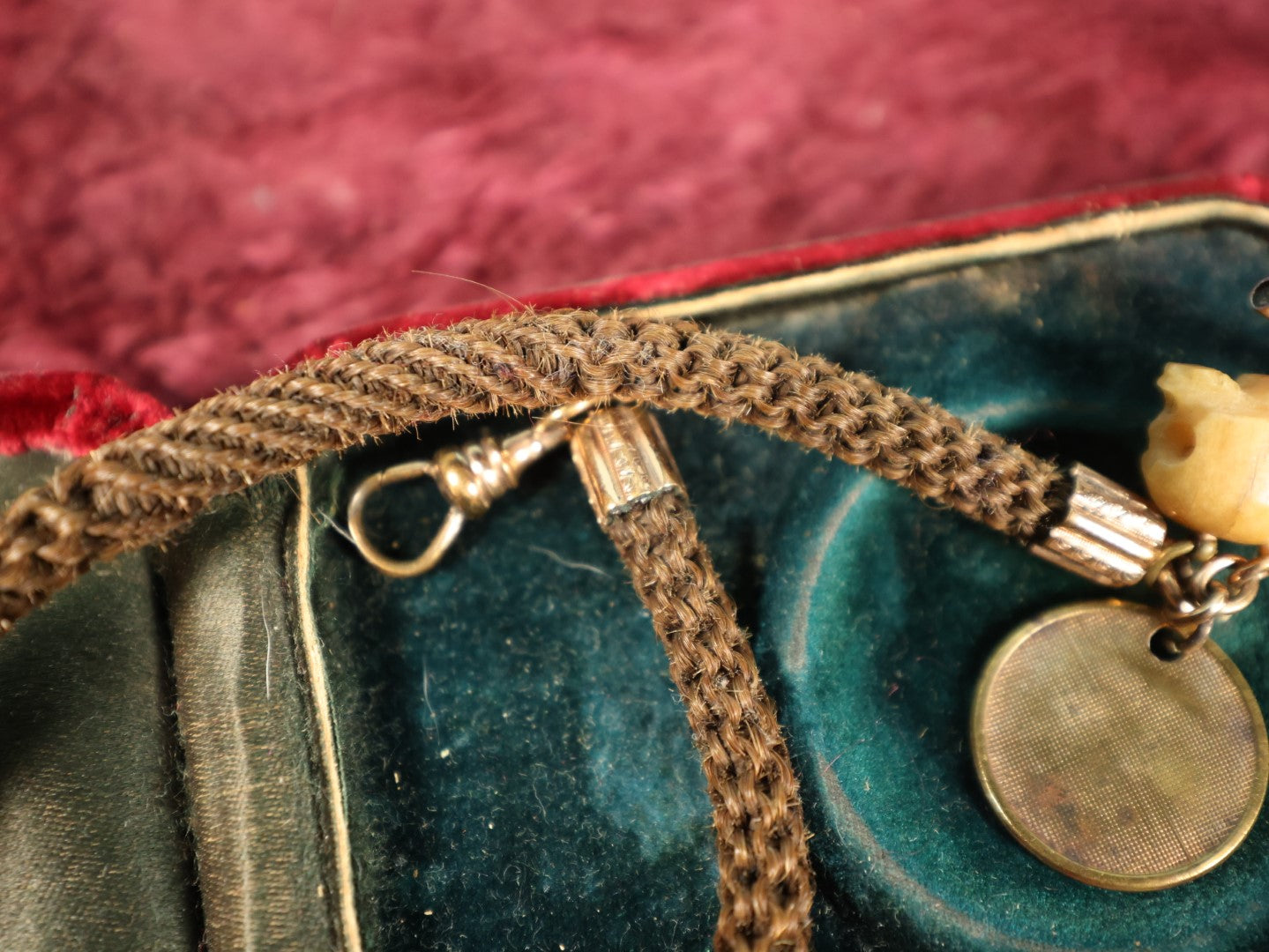 Lot 003 - Antique Victorian Human Hair Watch Chain With Carved Skull Charm And Brass Smoking Frog Coin, In Jewelry Case