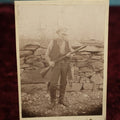 Lot 016 - Antique Cabinet Card Boarded Photo Of Hunter Or Trapper Holding Shotgun, With Raccoon On His Belt, Fur Trapper Trader, Hunting Interest, By Eagle Photo Company, Fall River, Massachusetts