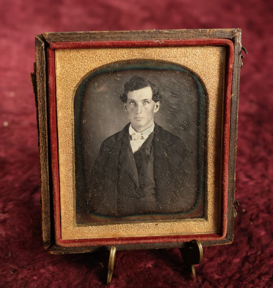 Lot 020 - Antique 1/6th Plate Daguerreotype Of Handsome Man With Defined Bone Structure, Cheeks, Bowtie, Light Colored Eyes, In Half Case