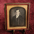 Lot 020 - Antique 1/6th Plate Daguerreotype Of Handsome Man With Defined Bone Structure, Cheeks, Bowtie, Light Colored Eyes, In Half Case