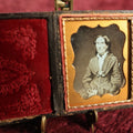 Lot 022 - Antique 1/9th Plate Daguerreotype Of Old Woman In Glasses, Wearing Gloves And Holding A Book, Case Pillow Says Haines & Co. Artists, Full Case, Worn Hinge