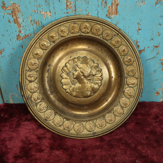 Lot 045 - Antique Cast Metal Wall Hanging Plaque Of Woman At Center Surrounded By Large Sunflower, Border Of Faux Coins With Various Subjects