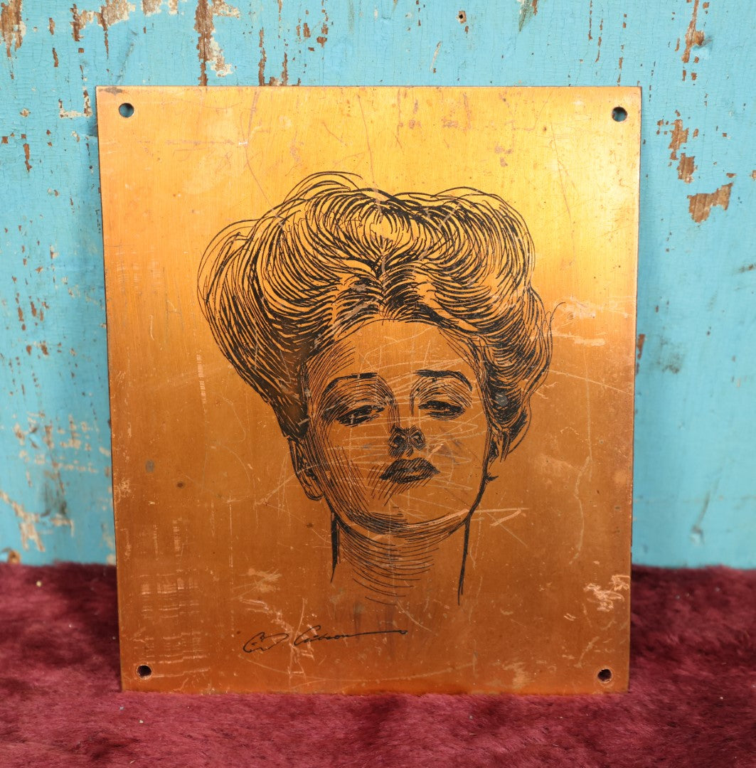 Lot 054 - Charles Dana Gibson, "Gibson Girl," Flat Metal Plaque, Various Wear, Severe Scratching