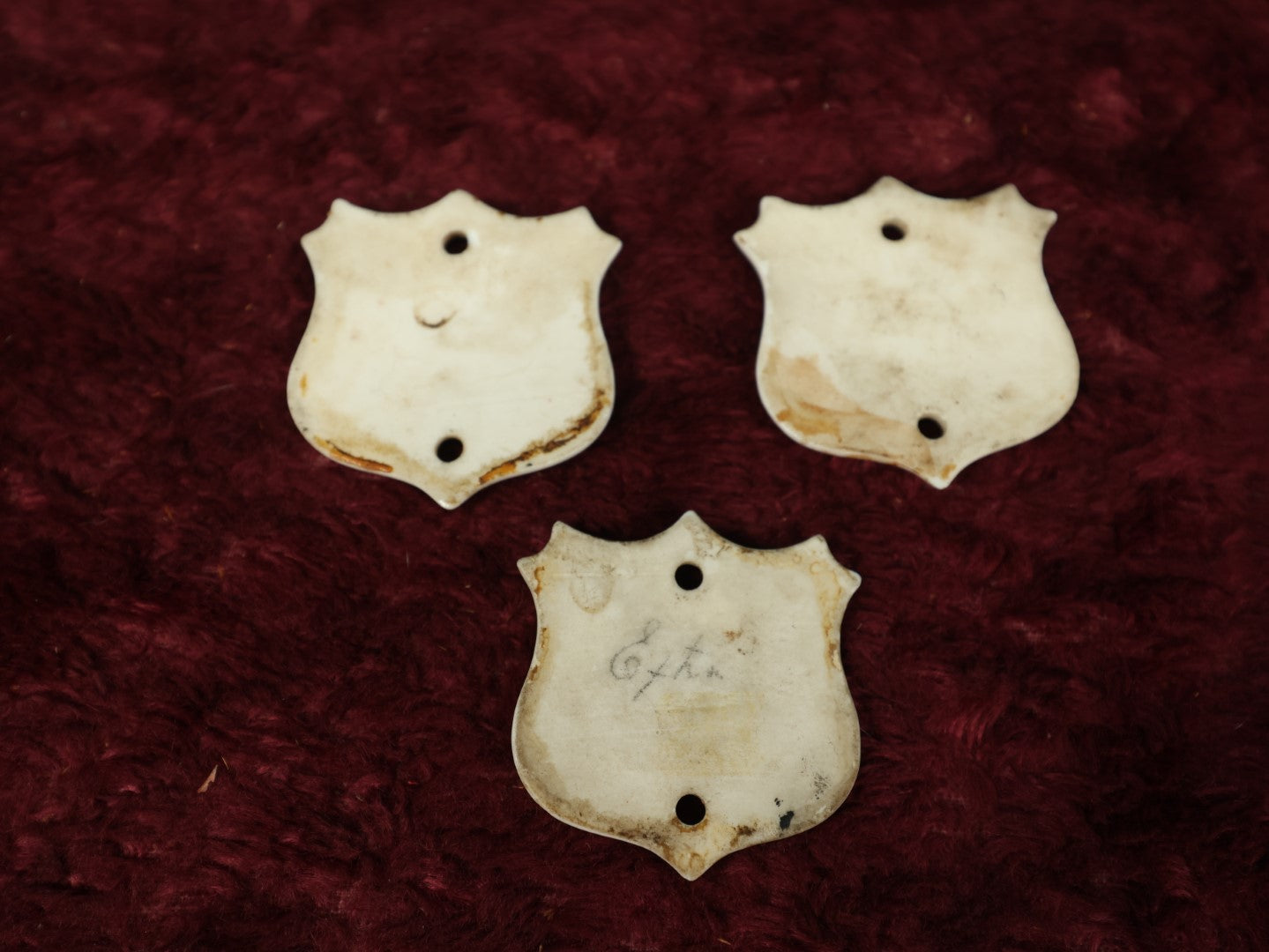 Lot 066 - Grouping Of Three Porcelain Number Badge Shields, Possibly From Hotel, Room Numbers, Including 50, 75, And 77, Various Wear, Paint Losses