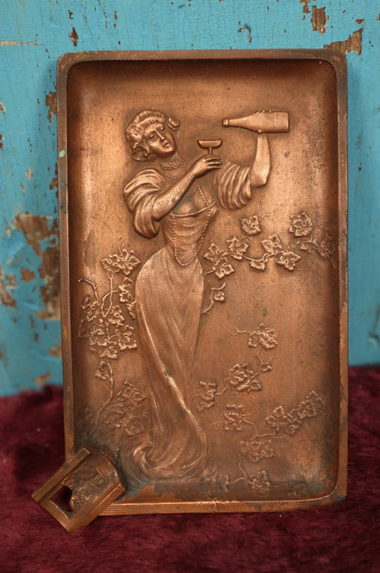 Lot 084 - Antique Cast Metal Ashtray Cigarette Tray Of Woman Pooring A Glass Of Wine, Surrounded By Leaves, Plants