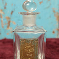 Lot 089 - Vintage Melliers Vogue Perfume Bottle, New York, St. Louis, Clear Glass, Gold Colored Label, Note Wear, Corrosion