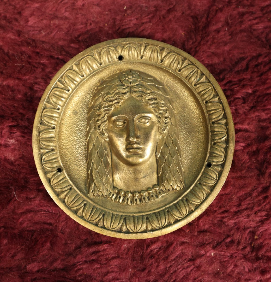 Lot 105 - Antique Heavy Cast Metal Circle Plaque With Woman's Face, Scaled Hair Design, Three Mounting Holes