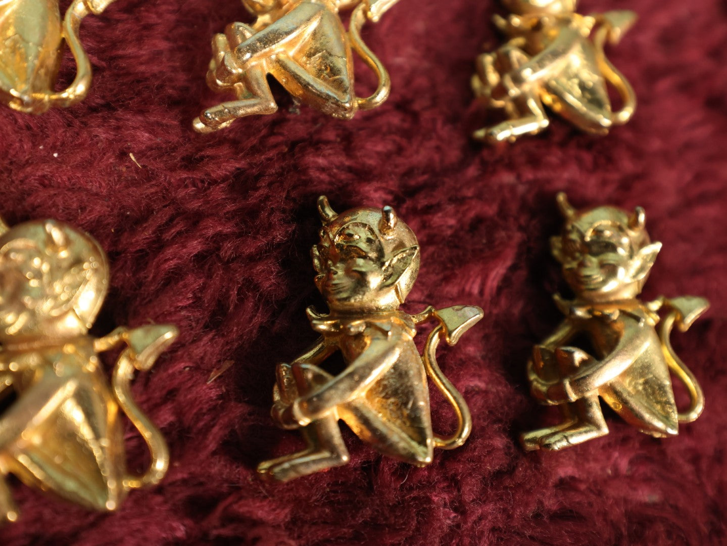 Lot 118 - Eight Vintage Brass Little Devil "Hot Stuff" Pinback Pins, Brooches Grouping