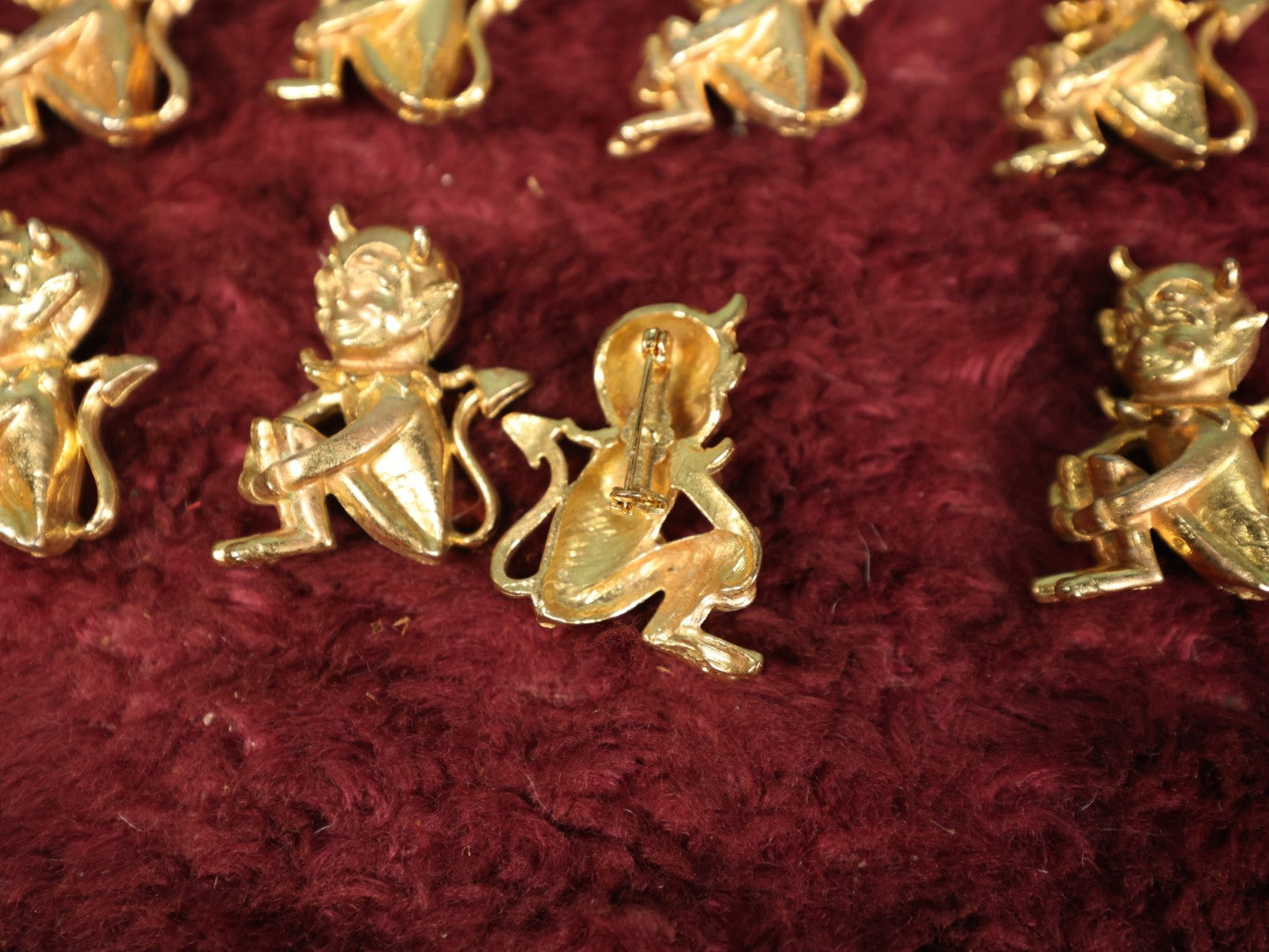 Lot 118 - Eight Vintage Brass Little Devil "Hot Stuff" Pinback Pins, Brooches Grouping