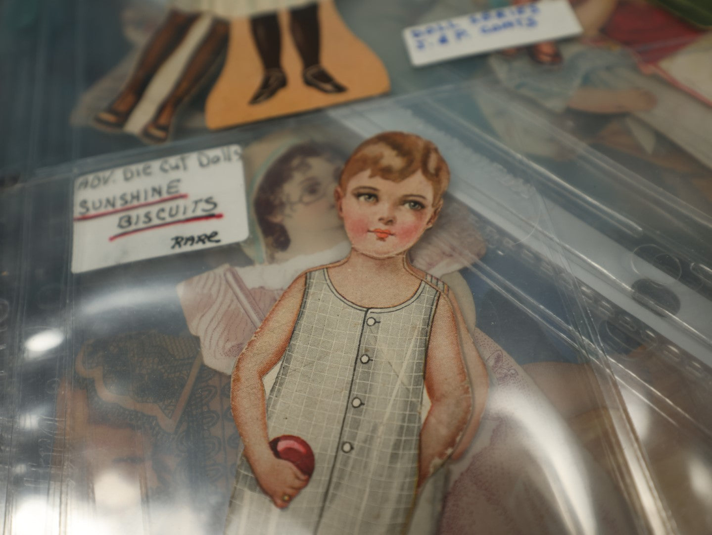 Lot 145 - Massive Cache Lot Of Good Condition Paper Doll Advertisements With Accompanying Clothes, Nearly 50 Complete Sets, Worcester Salt Co, Sunshine Biscuits, Thread, Coffee, And More