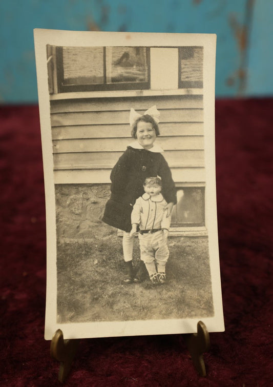 Lot 169 - Single Snapshot Photo - Young Girl With Creepy, Tall Doll