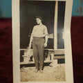 Lot 171 - Single Snapshot Photo - Young Man Holding De-Feathered Chicken And Knife... Or Is That A Doll