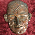 Lot 045 - Vintage Cast Plaster Bronze Washed Face Plaque Of Will Rogers