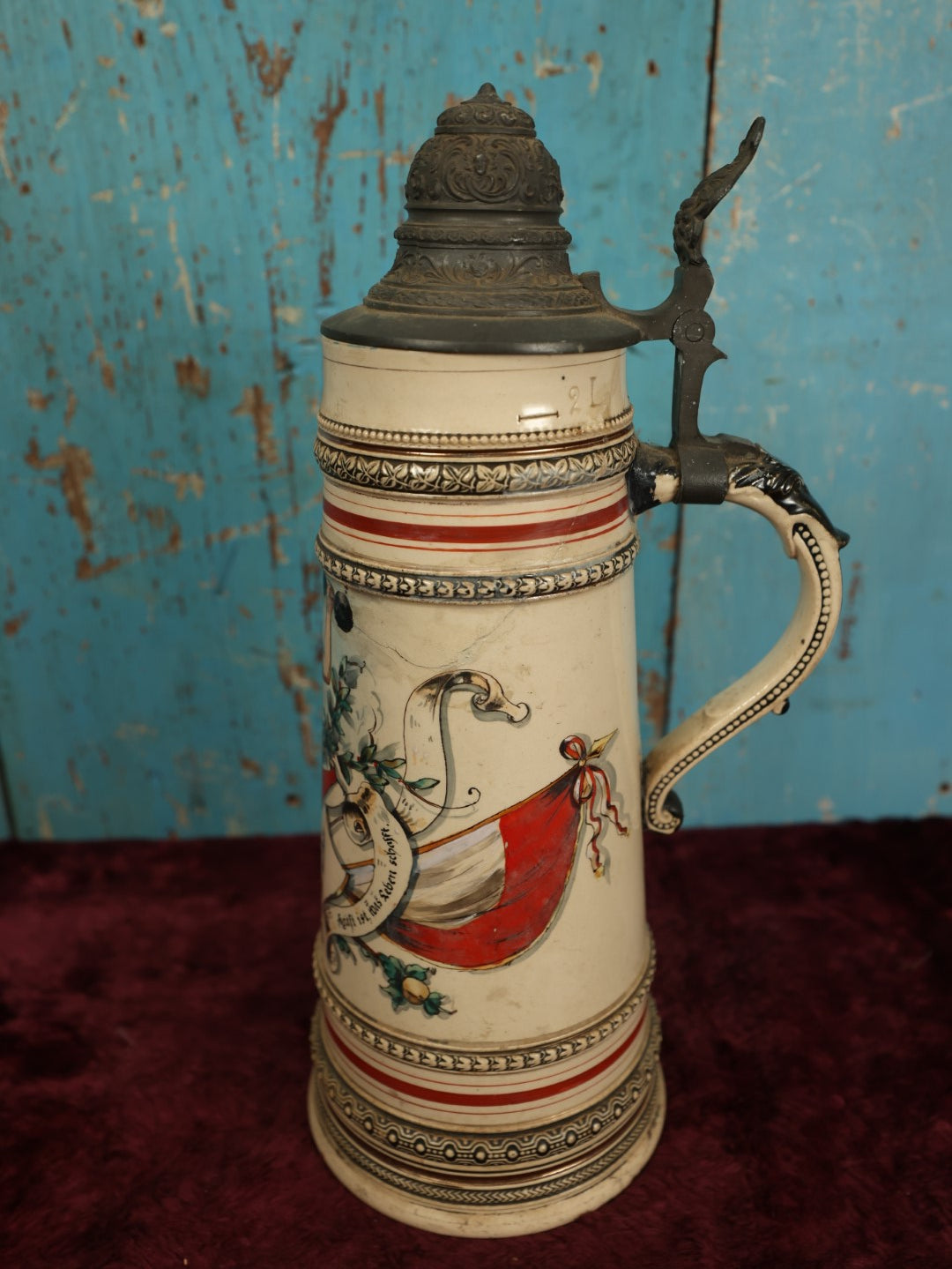 Lot 047 - Antique Hand Painted German Strong Man Stein With Weight Lifter, Metal Top, Two Liter, Note Heavy Damage, Repairs, Wear, Cracking