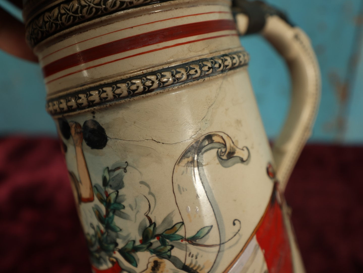 Lot 047 - Antique Hand Painted German Strong Man Stein With Weight Lifter, Metal Top, Two Liter, Note Heavy Damage, Repairs, Wear, Cracking