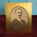 Lot 064 - Antique Brass Bradley And Hubbard Photo Frame With Photo Of Man With Mustache, Note Wear, Corrosion