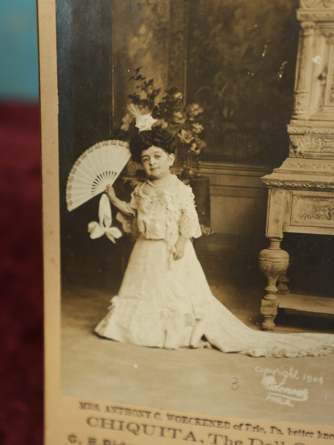 Lot 066 - Antique Side Show Cabinet Card Of Little Person Mrs. Anthony C. Woeckener Of Erie, Pennsylvania, Better Known As Chiquita, The Doll Queen, C.E. Ridenour Studio Photographers, Philadelphia, Pennsylvania, Copyright 1904