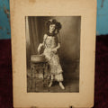 Lot 068 - Antique Boarded Photo Of Pretty Woman With Elaborate Costume, Drumming, Photographed By Charles "Chas" Betz Of Louisville, Kentucky, "Love To Mama And Papa From Florence," Writing On Back