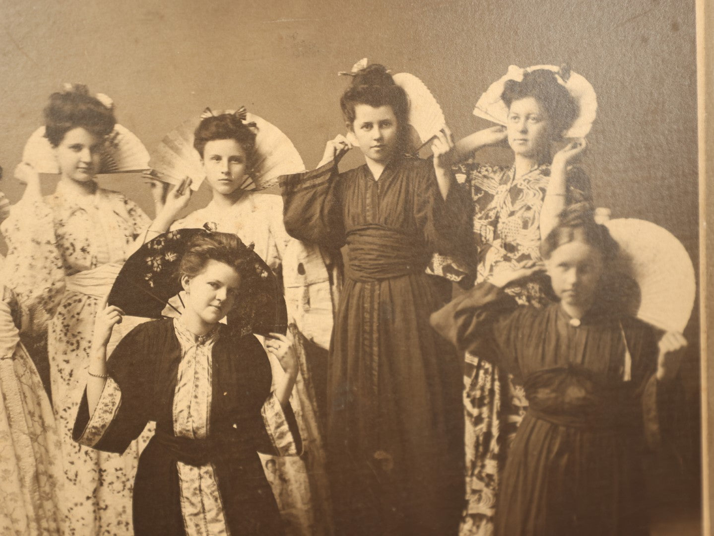 Lot 069 - Antique Boarded Group Photo Of Nine Women In Kimonos With Fans, Trimmed On Side