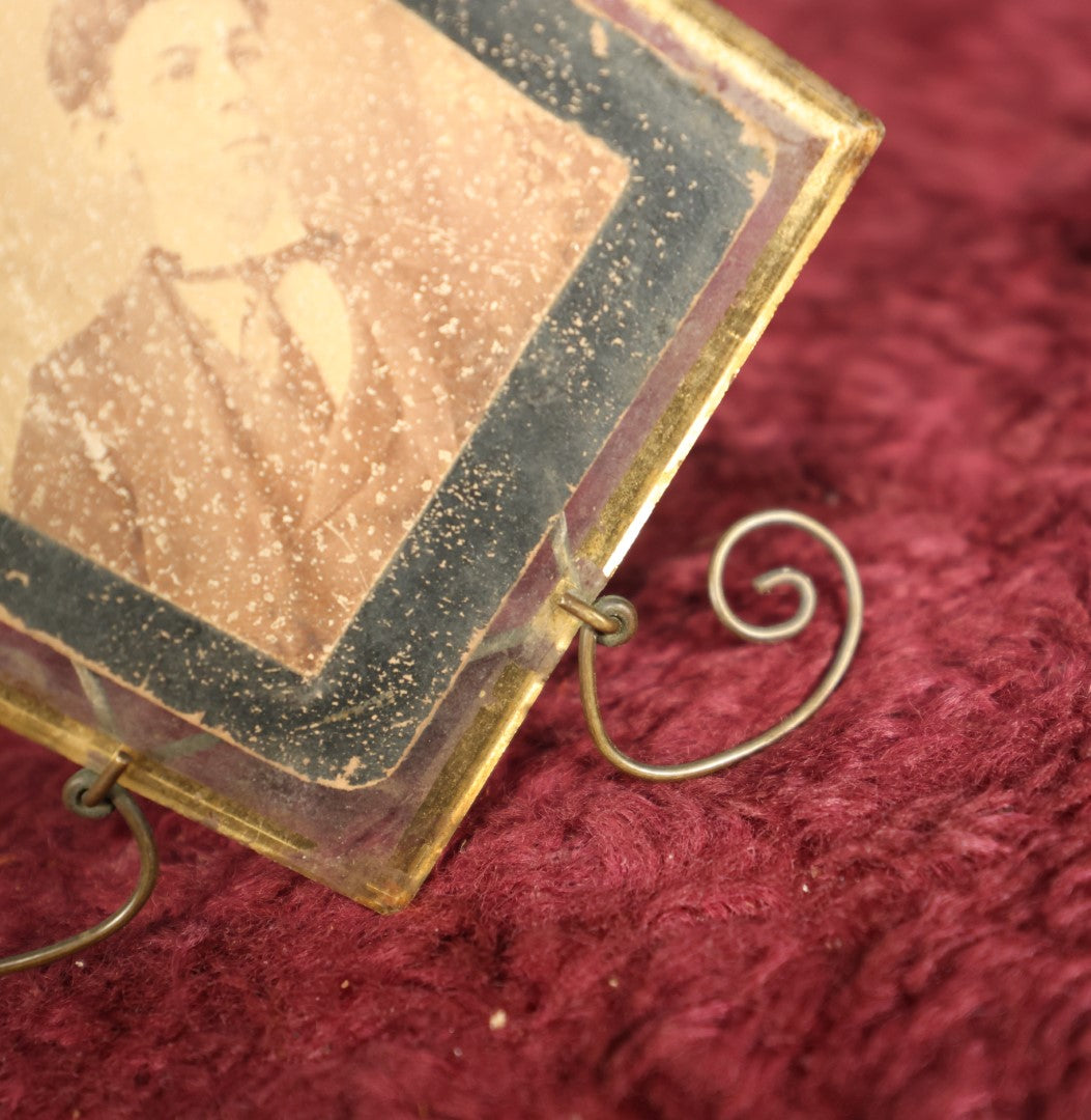 Lot 070 - Small Antique Boarded Photo In Unique Brass Wire Frame With Glass Plate, Note Wear To Photo, Chip In Glass, Wear To Reverse Gold Paint On Glass