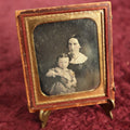 Lot 071 - Antique 1/6th Plate Daguerreotype Photograph Of A Mother Holding Daughter, Wearing Lace Gloves, Full Split Case With Woman Holding Cornucopia
