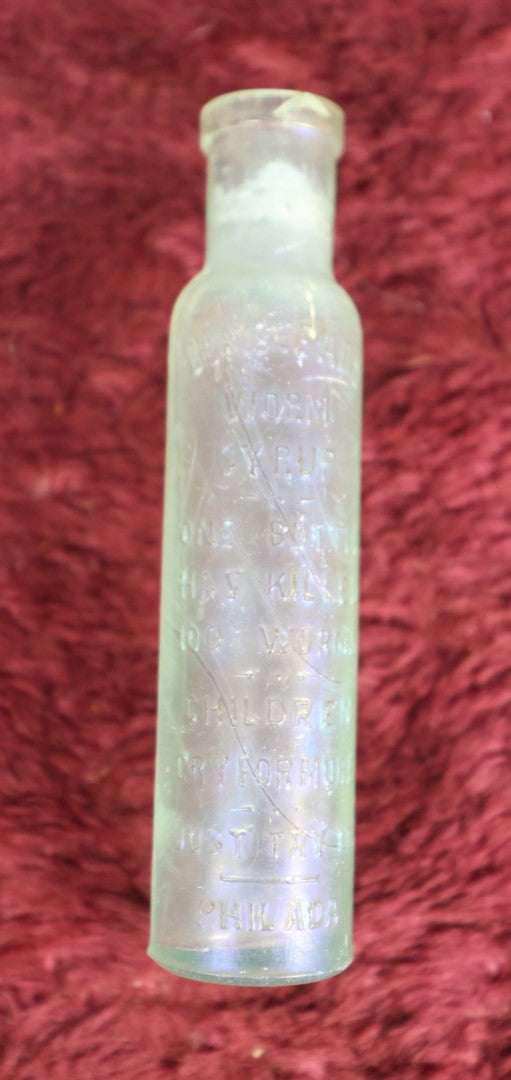 Lot 079 - Antique Glass Bottle For Bumstead's Worm Syrup, "One Bottle Has Killed 100 Worms, Children Cry For More, Just Try It," Philadelphia, Pennsylvania