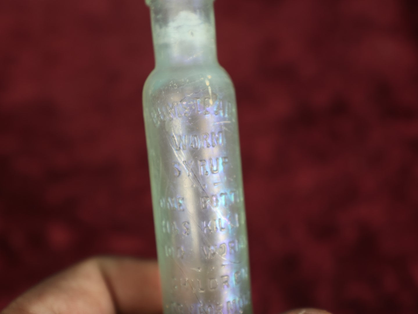 Lot 079 - Antique Glass Bottle For Bumstead's Worm Syrup, "One Bottle Has Killed 100 Worms, Children Cry For More, Just Try It," Philadelphia, Pennsylvania