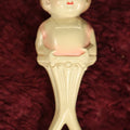Lot 082 - Vintage Celluloid Baby Toy Figural Rattle With Little Girl, Pink Shirt, Note Split On Back, Contents Lost, Maker's Mark