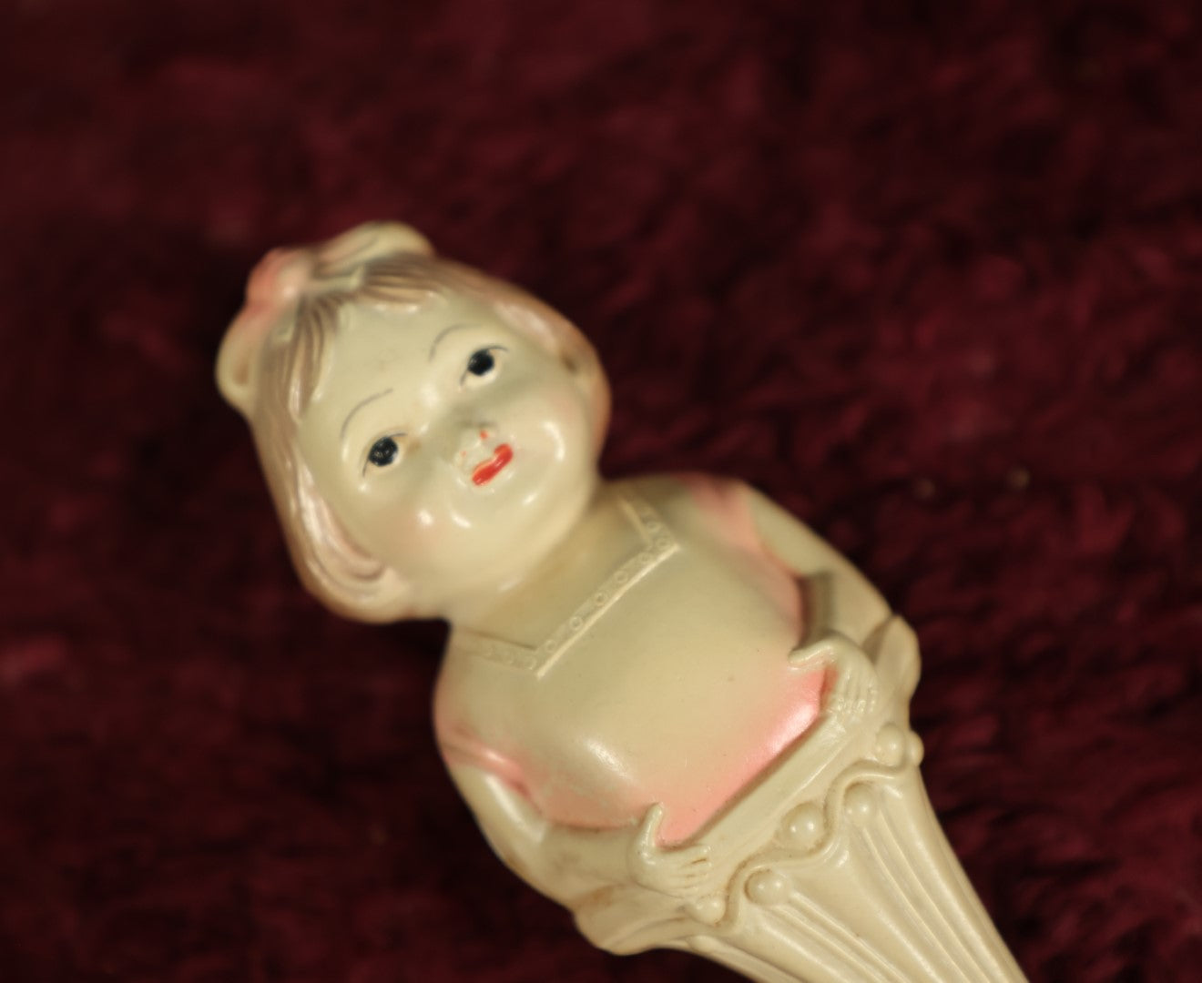 Lot 082 - Vintage Celluloid Baby Toy Figural Rattle With Little Girl, Pink Shirt, Note Split On Back, Contents Lost, Maker's Mark