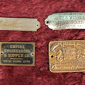 Lot 087 - Grouping Of Four Antique Metal Manufacturer's Badges, Kots & Winegar Dry Goods, Kenosha Wisconsin, Nash-Seaman Factories, Empire Engineering & Supply Co., New York City, New Standard