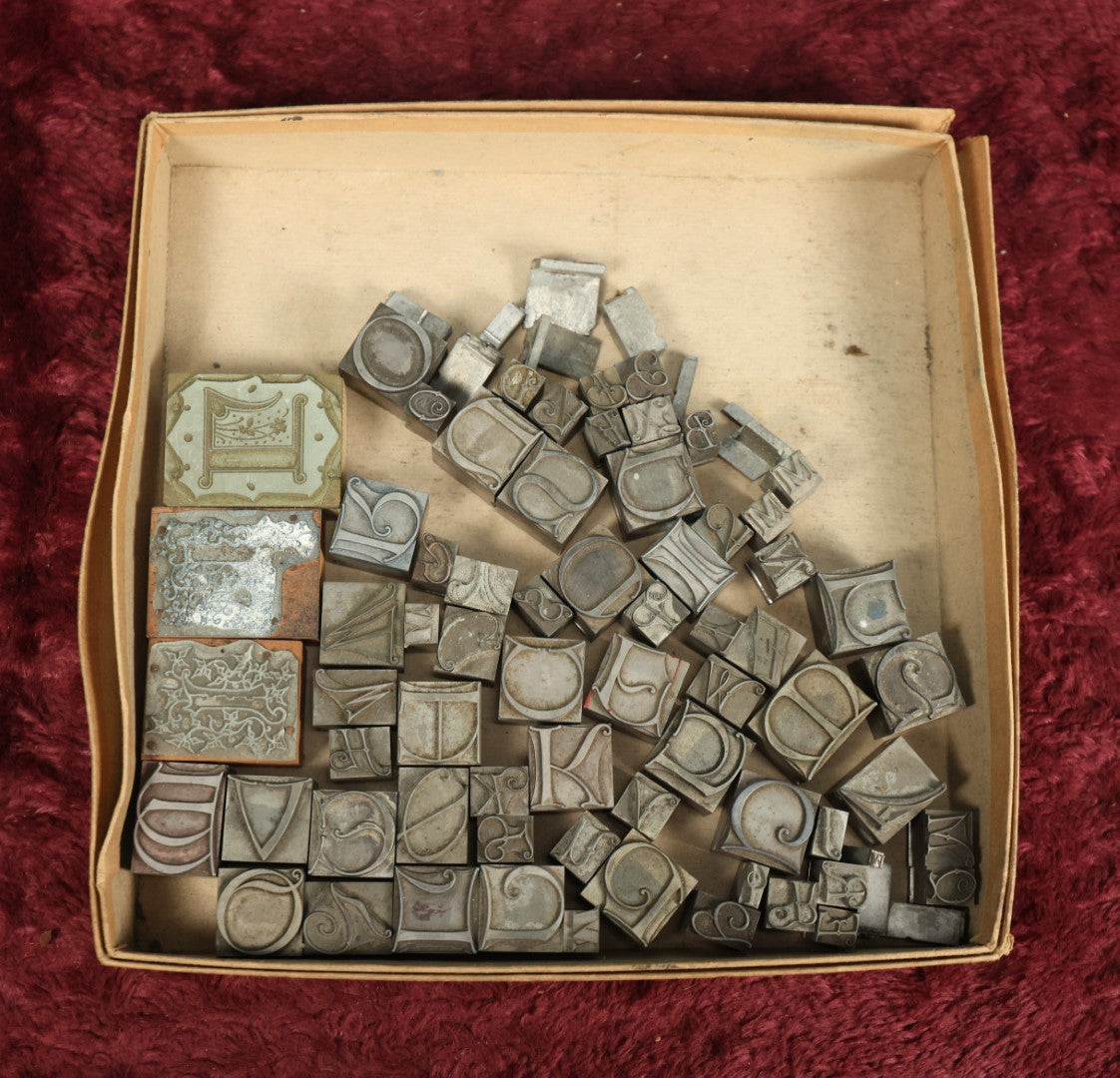 Lot 092 - Grouping Of Antique Solid Metal Letter Press Printing Block Stamps, Curvy Letters And More, 50+, Drop Caps, And Others