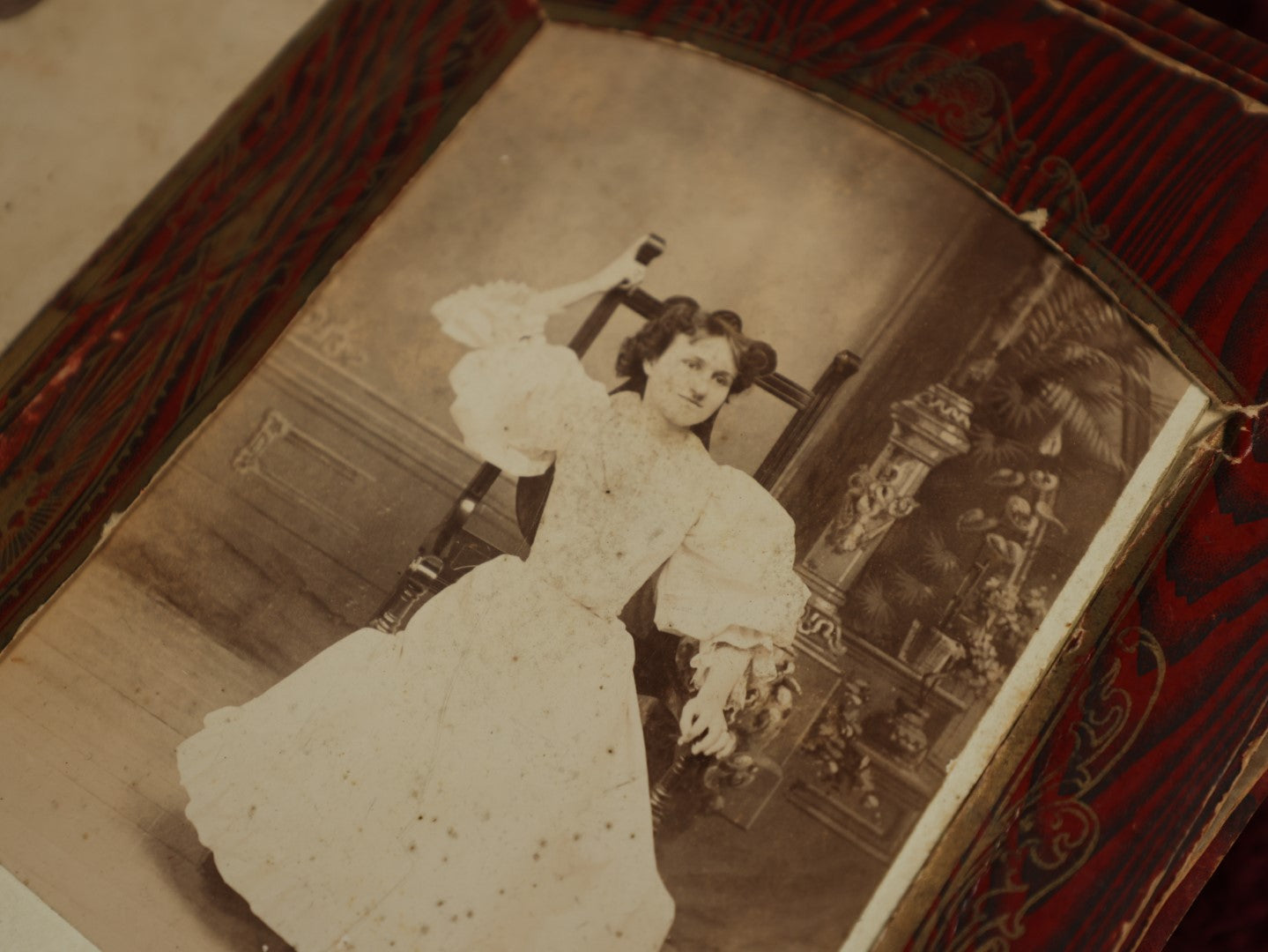 Lot 104 - Antique Craft Grade Cabinet Card Photo Album With Celluloid Cover Of Woman And Child On Riverside, Containing Several Cabinet Cards, And Tintypes, Mostly Empty, Heavy Wear