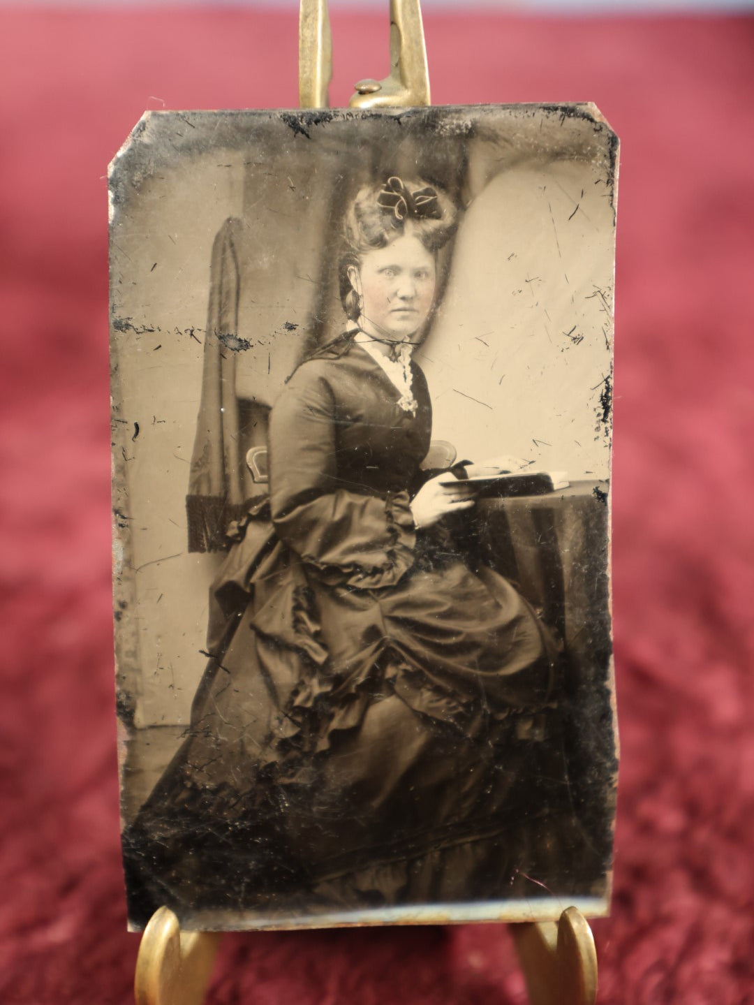 Lot 118 - Single Tintype Photo, Woman Sitting At Table With An Open Book, Reading