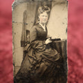 Lot 118 - Single Tintype Photo, Woman Sitting At Table With An Open Book, Reading