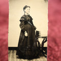 Lot 129 - Single Tintype Photo, Young Woman, Possibly Pregnant, Holding Photo Album On Table
