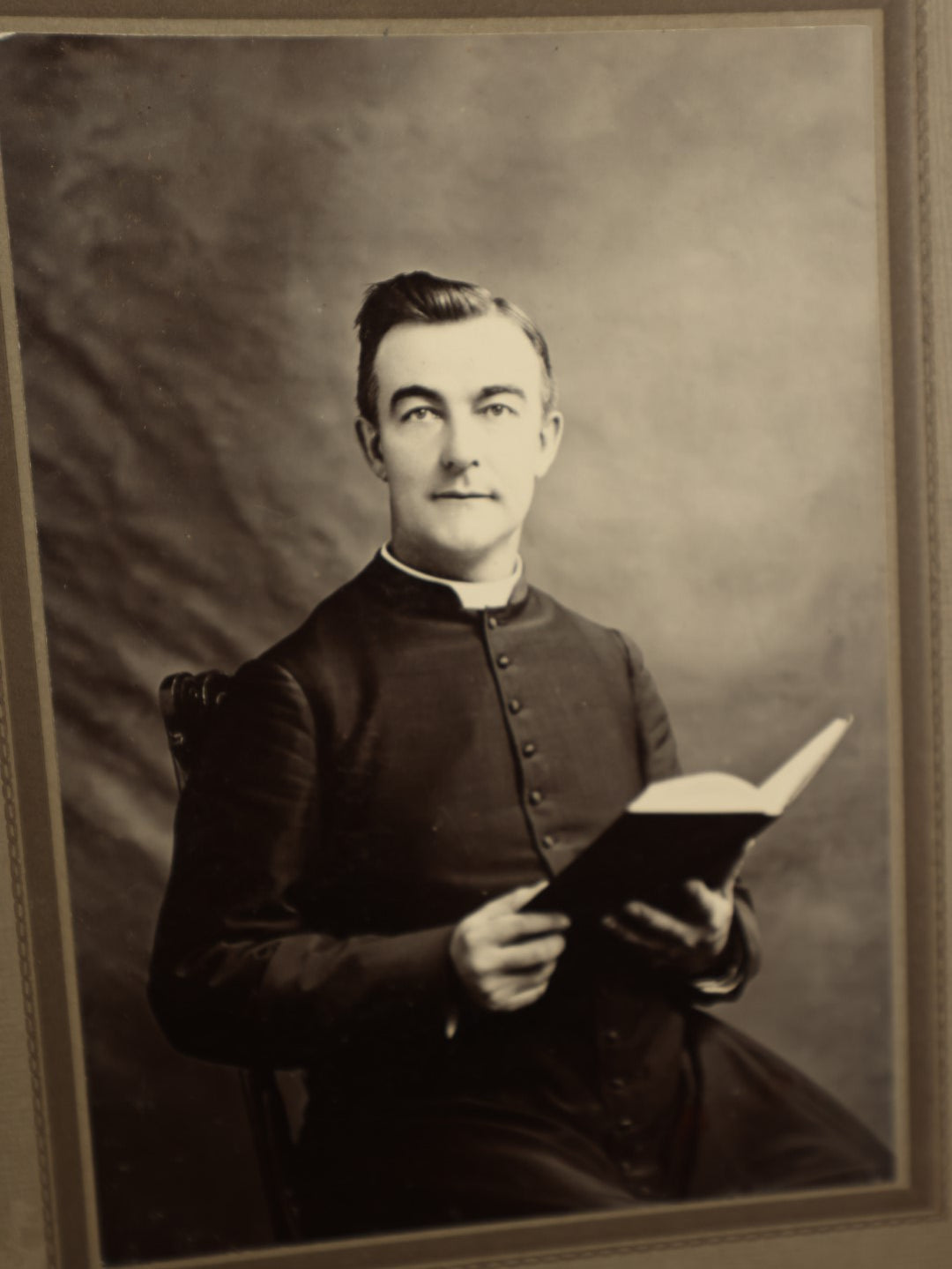 Lot 139 - Single Antique Boarded Photograph Of A Priest Holding A Bible, Joyce Photographer, Housatonic, Massachusetts