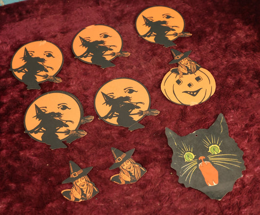 Lot 025 - Grouping Of Eight Plus Vintage Halloween Paper Cutouts Including Witches, Pumpkin, And Cat Face, With Extra Scraps