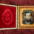 Lot 035 - Antique 1/16th Plate Daguerreotype Photograph In Intact Case Of Man With Beard, Flower On Red Pillow, Heavy Wear