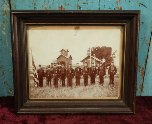 Lot 054 - Antique Framed Boarded Photo Of Soldiers With Various Ribbons, Flag, Etc., Possibly Nebraska Volunteers Or Militia, As Written On Back Of Frame