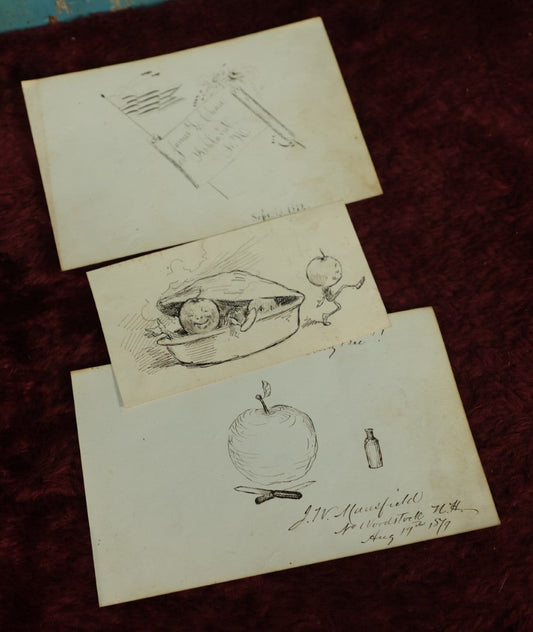 Lot 071 - Grouping Of Three Original Pen And Ink Sketches, 1972 Depiction Of The American Flag From Ashland, New Hampshire, Anthropomorphic Apples Leaving Apple Pie, And Other Apple Related One, Dated 1879