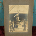 Lot 105 - Single Boarded Photo Of Deer Buck Strung Up, Hunters Look On Holding Rifles