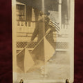 Lot 111 - Single Snapshot Photo, Woman With Flags, Wearing Peacoat And Hat