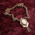 Lot 017 - Vintage Victorian Revival Necklace With Carved Brooch And Tassels On Thick Chain