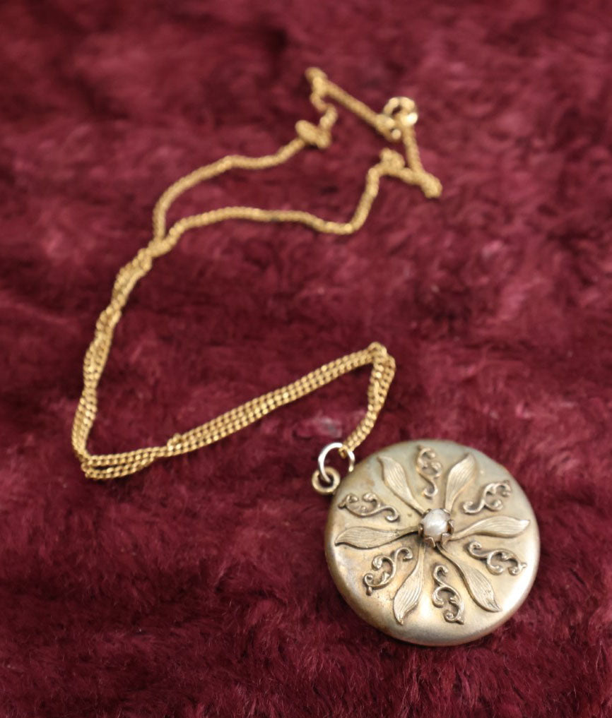 Lot 019 - Vintage Brass Locket On Gold Filled Chain Containing A Photo Of A Man And A Lock Of Blonde Hair