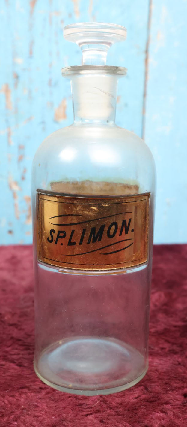 Lot 040 - Antique Lemon Extract Apothecary Bottle With Glass "Sp. Limon" Label, Approximately 12", From H.R. Kimball Pharmacy, Hardwick, Vermont