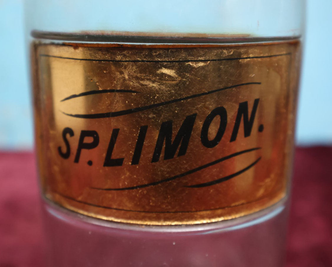 Lot 040 - Antique Lemon Extract Apothecary Bottle With Glass "Sp. Limon" Label, Approximately 12", From H.R. Kimball Pharmacy, Hardwick, Vermont