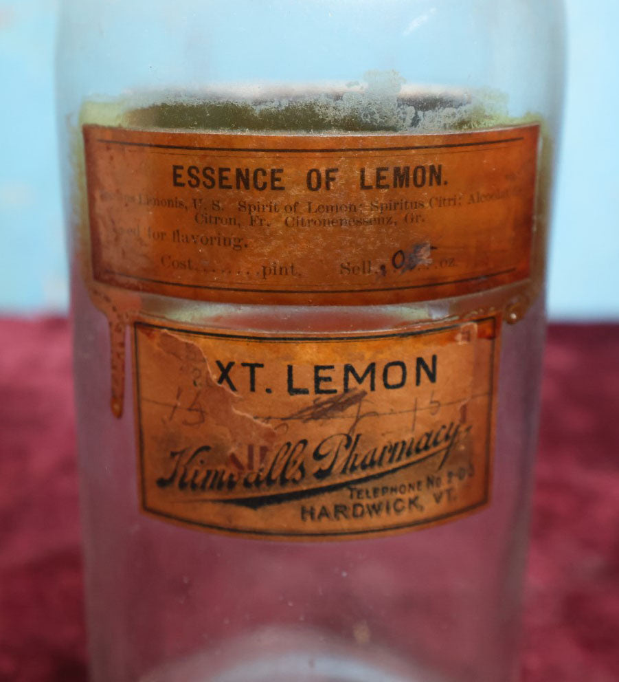 Lot 040 - Antique Lemon Extract Apothecary Bottle With Glass "Sp. Limon" Label, Approximately 12", From H.R. Kimball Pharmacy, Hardwick, Vermont