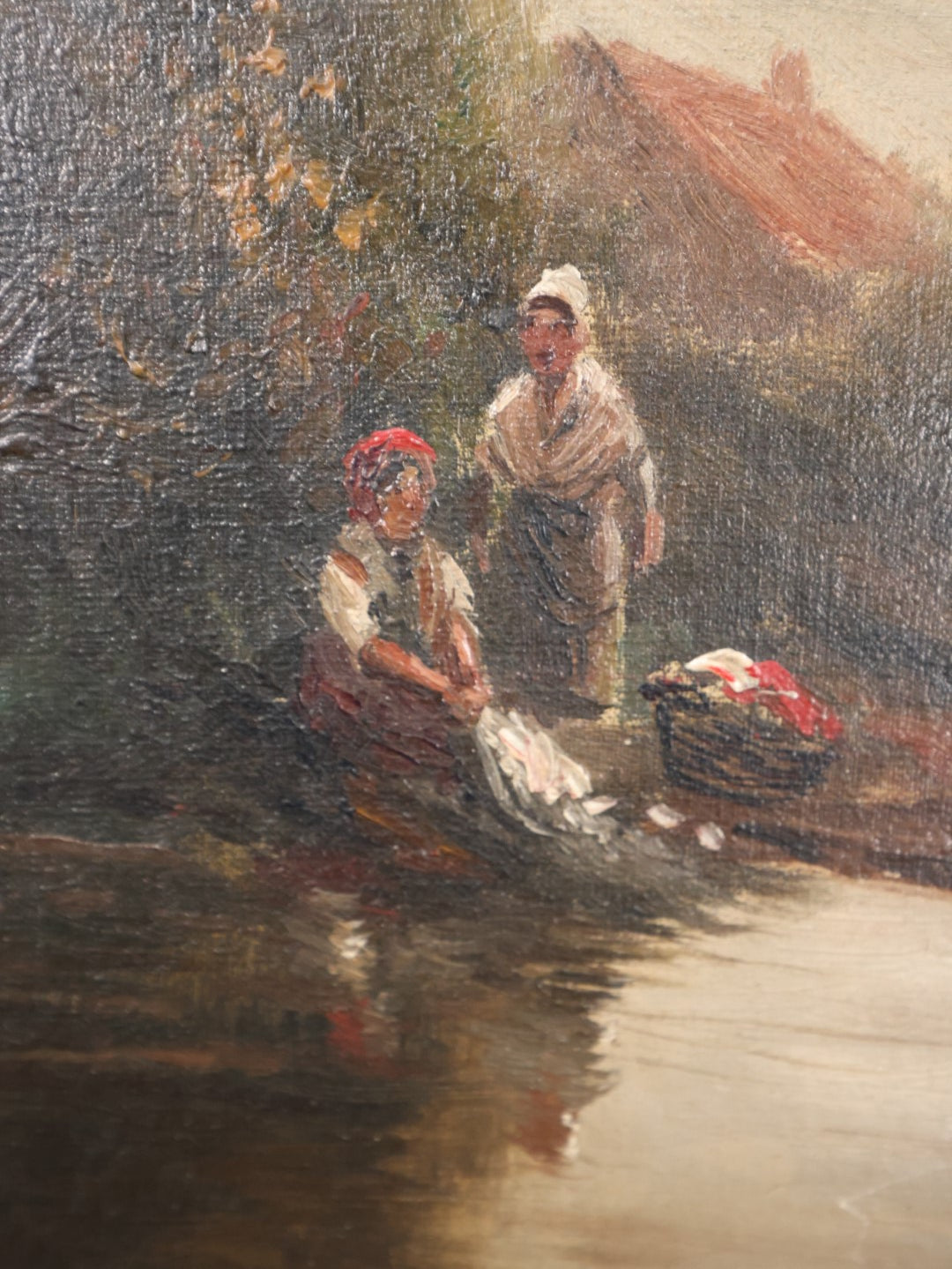 Lot 055 - Antique Oil On Canvas Of Two Women Doing Washing At A River Bank, Foliage And House In The Background, Artist Signed, Illegible, Possibly Comas, Heavy Wear And Tears